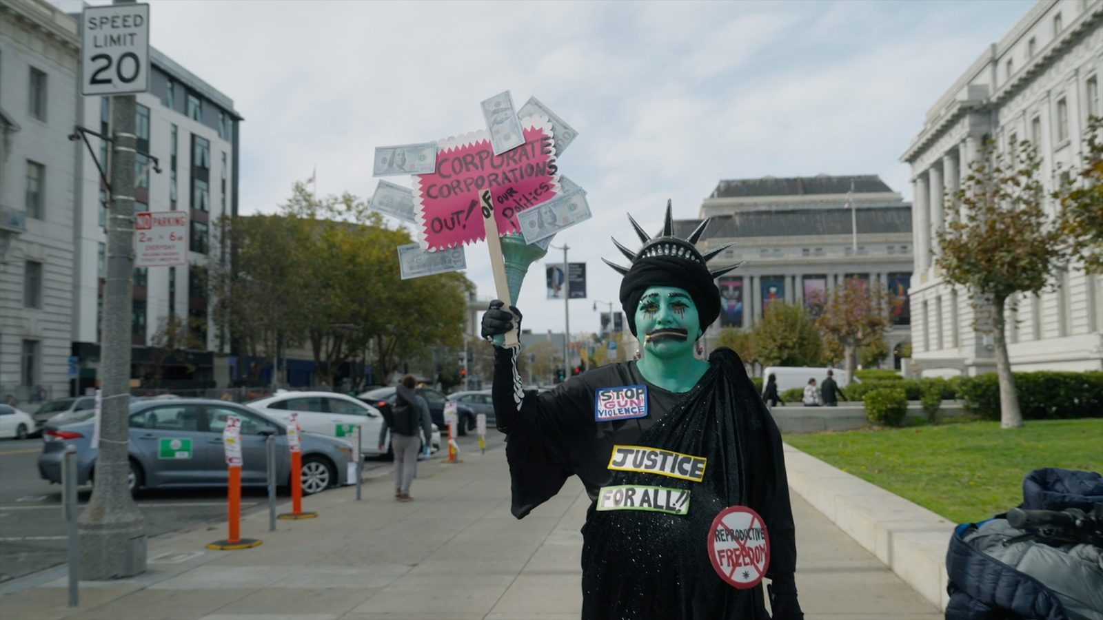 a person in a Statue of Liberty costume on the street